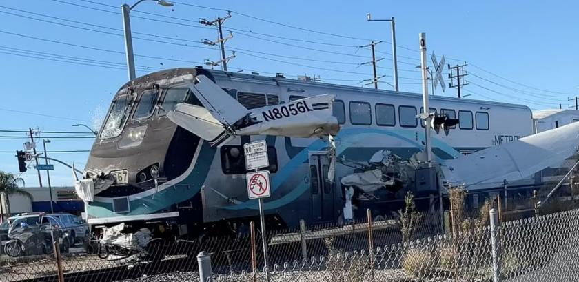 Train smashes into crashed plane